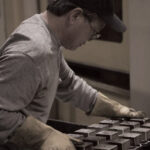 Polydeck employee working on a panel