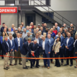 Cutting the ribbon at a grand opening ceremony