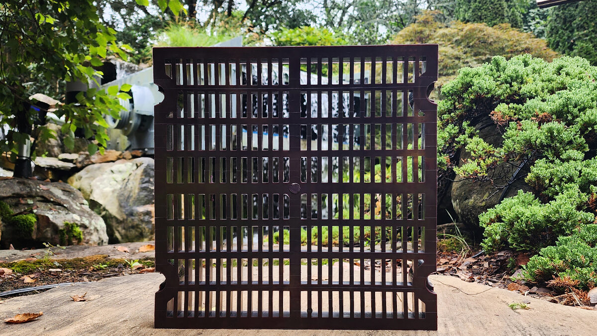 Recycled Screen Media in front of Waterfall