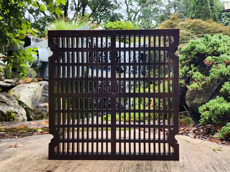 Recycled Screen Media in front of Waterfall