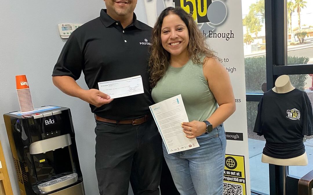 Nate handing check to Project 150