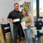 Nate handing check to Project 150