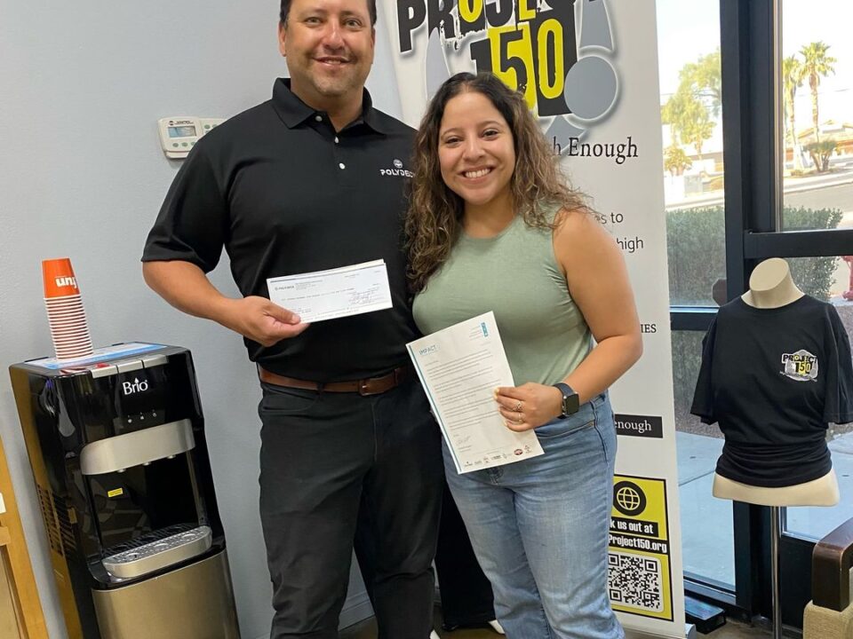 Nate handing check to Project 150